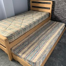 Single bed with slide under (spring loaded legs ) guest bed
Including two mattresses one barely used
In used but condition
Hip hop ash bed originally £400 without mattresses 
Collection only