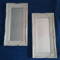 Ornate cream frames and bevelled mirrors 
Approx 14.5" x 7.25" (37 x 19cms)