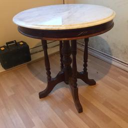 Wooden marble top round table 
I’m good condition only the rim looks like it has a different. Shade in some part but barely visible 
Need gone ASAP. 
Open to offers