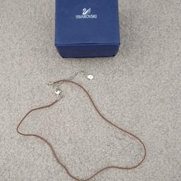 This is a gorgeous genuine Swarovski love heart and pink butterfly pendant on a brown waxed cord.

Necklace is adjustable. The cord fastens with an adjustable rhodium plated silver tone lobster clasp & extender chain

Excellent condition, only worn a few times. will be sent with the box. theres a couple of marks onnthe box as shown in the photos.

Smoke & pet free home