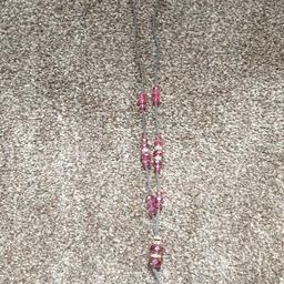 Used necklace.
Material with glass stones.