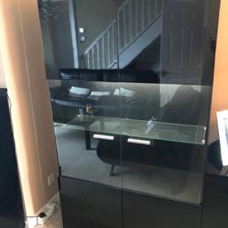 Tall display cabinet in black gloss

Complete with electric light and glass shelves

Loads of storage and just looks amazing. Supreme quality very heavy and in fantastic condition.

Size is length 1040mm x height x 1850mm x depth 400mm.

I have 2 of these for sale!!

This cost £1750 when new so grab an absolute bargain here.

Complete with electric lights look amazing

Please look at my other furniture I have to match this

Pick up only no delivery

Reduced Price is £25

For a quick sale!!!