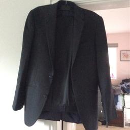 Two piece suit dark grey excellent condition worn for a couple of hours . Jacket is a 36 regular and trousers 30 waist 31 leg