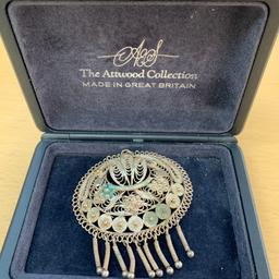 Selling this silver brooch. It comes with a box but I don’t know if it’s the original box. 
The brooch needs to be cleaned. Please see the pictures