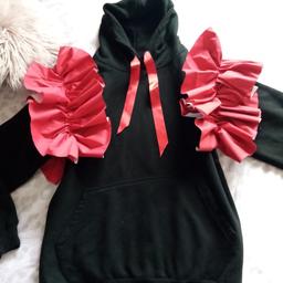 Gourgoues black hoody , big red frilly shoulders and red ribbon pull , pocket in front , daughter worn it once , exellent condition collection Kirkby £15