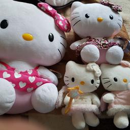 ty hello kitty plush like new one large and 3 smaller ones. with tags to make original.