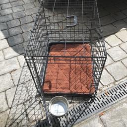 With steel water bowl attached to cage