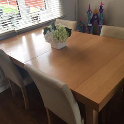 Oak table cream leather seats..seats need new covers on but a sturdy solid table worth over £500 new