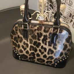 shiny black and leopard print bag great condition with diamante detail to the front and a big diamante clasp to open and shut its collection only no posting no delivery
