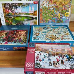 5x 1000 piece puzzles. Assorted themes. All pieces are there :)
