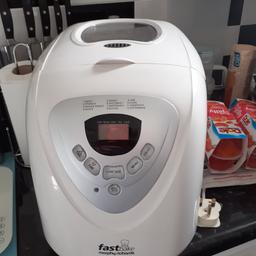AS NEW ONLY USED TWICE FAST BAKE BREAD MAKER, COMES WITH 2 COOKERY BOOKS AND INSTRUSTIONS
