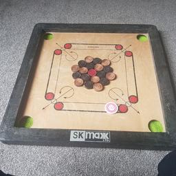 Kids size carrom board 
It included striker and coins..