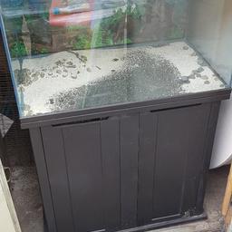 large fish tank with stand.
the lid will need some attention as it has warped, so no longer straight, or it could be removed...the light still works, a new filter would also probably be needed.....just £20