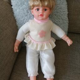 Sitting doll lenghth 24 inches. Wearing top and trousers