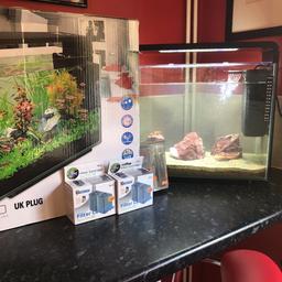 HOME 40 AQUA SCAPING AQUARIUM WITH 2 PUMP/FILTERS SEA ROCK 3 COLOURED SAND SET UP 3 WEEKS AGO NOT HAD FISH IN STILL UNDER WARRANTY WITH EXTRA FILTERS SUNRISE LIGHT LIKE BRAND NEW £85 NO OFFERS