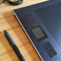 Drawing tablet with pen, holder and wireless adaptor.