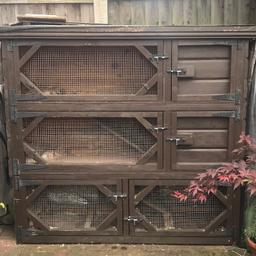 This is a solid custom made log lap hutch not like the usual the pet shop rubbish. Purchased approx 4 years ago from ryedale pet homes.

no rot anywhere, has had a cover on since new, 3 storey high with run underneath, the ladders are removable if you wanted to separate the top 2 parts to house different pets, has night shutters for winter and fox proof bolts.

I have treated the front to protect from the elements however the sides and rear are still natural wood, the paint can be included.
