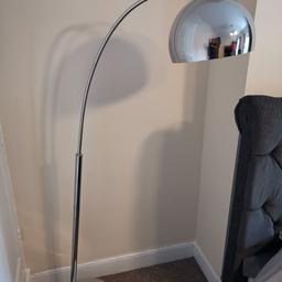 Chrome floor lamp with heavy base, foot switch and vintage bulb.
great working condition.