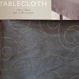 Brand new luxury spiral tablecloth in silver/dark grey.  Seats 4-6, size 132x178cm