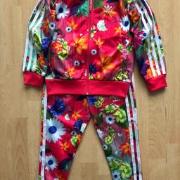 These tracksuit is just gorgeous, lovely design and pleasant material. Condition just perfect, the trousers have never been used. Size 5-6.