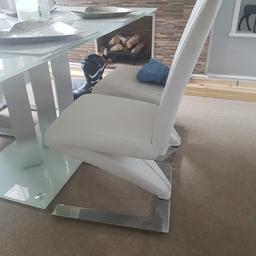 Used but in generally good condition bar from scrape on one chair as per pic. Look lovely with a white or glass table (and they are heavy and solid).
Chairs could do with a deep clean as they are white faux leather so a bit grubby here and there ....hence low selling price.
Collection New Ferry
