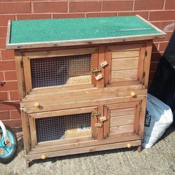 not used for long before one of our rabbits passed away now used as storage lol. has a few chew marks but doesn't affect use. it has 2 doors on each which I fitted better locks on both big doors.  both trays pull out for better cleaning access.  roof has weather is weather proof and opens up for better access. I don't drive so will need collecting