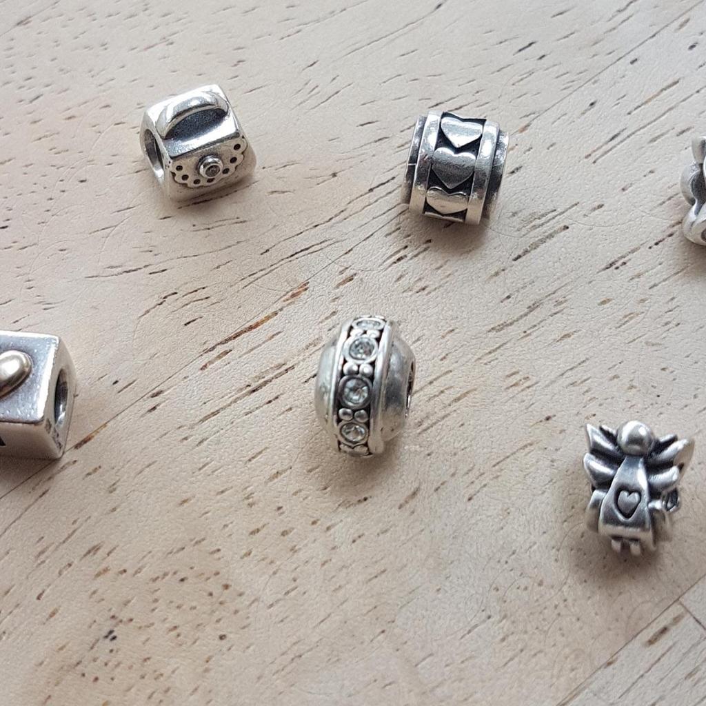 6x Pandora charms all stamped 925 silver. All in good condition see photos, (1 stone is missing from the circular stone charm)

Collection Ribchester or happy to post for postage fees.

Open to offers
