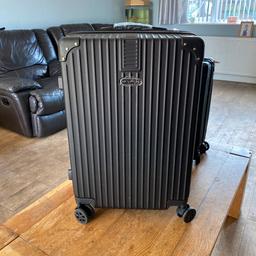 New 4 wheel suitcase
Lightweight 
39 inches high inc handle 17 inch wide 11inchs deep 
Collection only