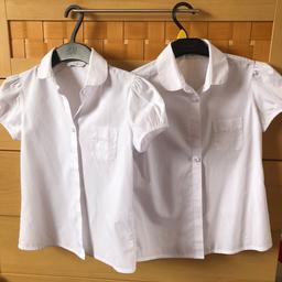 Two girls M&S white short-sleeved shirts age 8-9 years (chest 69cm, height 134cm) - 2 part set with flower buttons and embroidered flowers on the pocket. In good clean white condition - only worn a few times as preferred to wear polo shirts. Collection only from Dudley DY1 - sorry no delivery or posting. Check out my other items.