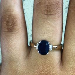 Lovely midnight blue genuine sapphire with real diamonds set to either side complimenting the ring . All set in 9 ct yellow gold . 
PayPal accepted 
Postage £6.70 tracked insured and signed for