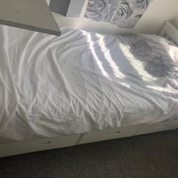 White wooden single bed and mattress. 3 drawers across the bed. Wooden planks across for the mattress, one slab is damaged needs repairing. 
Collection Romford