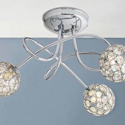 Sleek and sophisticated, the Amelia 3 Light Beaded Globes Ceiling Light will brighten up your living space with style. Decorated with clear, crystal-like beads to produce a beautiful, reflective light pattern, it features curling chrome arms, decoratively entwined for additional impact. Size H18.5, W40, D40cm.
Diameter 40cm.
Suitable for use with low energy bulbs.
Not suitable for bathroom use.
IP rating 20. Bulbs required 3 x capsule G9 eco halogen. Recommended maximum wattage: 25watts.