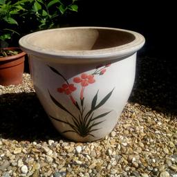 Frost proof flower pot with flower image front and back on cream crackle glaze background.  Approximately 13 inches high.