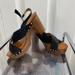 ladies wood effect black slingback platform heel sandals

size 7

buckle fastening

from ASOS but not there own brand