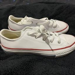 These are white with a red strip around them. Size UK 13 never worn. These were brought for Christmas but daughter doesn’t like the narrow top as she’s has wide feet. No tags or box
