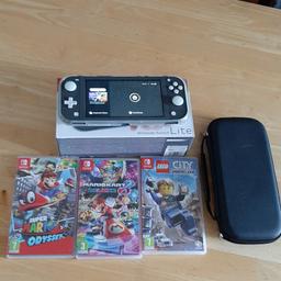 Nintendo Switch lite 3 top games and charger boxed and carry case and memory cards spare thumb grips and rubber case for when using it