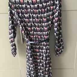 John Lewis Girls Dress 
11years 
Navy with cream and pink Deer 
Belt 
Concealed zip at back and elasticated waist . 
Smoke free home 
Collection only .