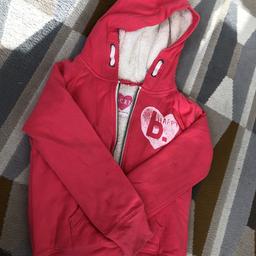 Girls hooded zipped jacket from Next with a lovely quality warm fleece lining for winter. From smoke and pet free home.