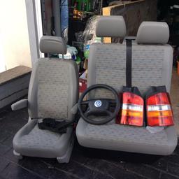 Vw t5 front seats, driver captains chair, bench seat with underneath storage in very good clean condition, front and rear original lights, steering wheel with airbag and a front grill with chrome strips.