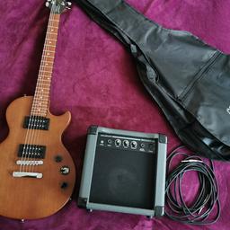 Epiphone les paul guitar vintage edition. Very good guitar for beginners, looks like new. Not used a lot, very good condition. As well amplifier 10W with gain effect and cover for guitar, brand new.