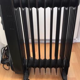 Black heater on wheels for easy moving. On/off switch and timer. Like new only 2 years old hardly used.