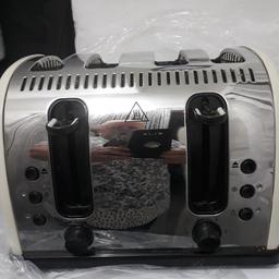 a lovely 4 slice cream n silver toaster hardly used .and a bargain asking price