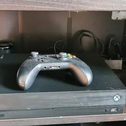 Xbox one x for sale with one controller and 2 games, less then 12 months old comes with box