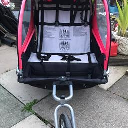 2 seater trailer which also goes into a pushchair. It goes onto a push bike or mobility scooter.. Good condition, it’s not been used as a pushchair, only as a trailer on the back of a mobility scooter, it’s slightly faded with the sun, has a raincover and flynet, comes with the flag so that it’s legal for it to be ridden on the road. Cost £100 new.