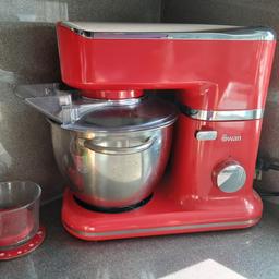 Swan mixer, microwave, bread bin, canisters, towel pole, mug rack and red and white mugs, Breville kettle and toaster, Tassimo coffee maker all in red. all good condition