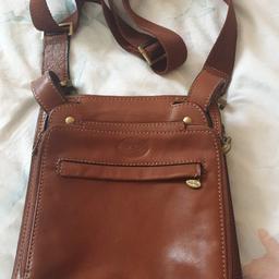 Italian leather cross body bag with 6 zipped pockets. very good condition. 

approximately 10 inch x 8 inch

Adjustable strap
