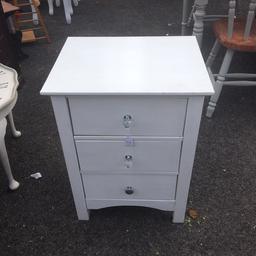 Shabby chic white draws with crystal handles on three good size draws solid piece of furniture excellent condition grab a bargain