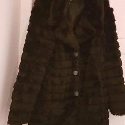 Beautiful designer coat very elegant black fur soft and comfortable to wear,UK size 20 but will fit size 18,just beautiful. bargain