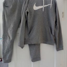 good condition grey nike tracksuit no stain very clean little rip at bottom of trousers but not noticeable and can be quickly patched up with needle and thread size M message me for more info about sizing postage included in price.
