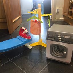 Toy washing machine, ironing board, iron and washing stand. Iron makes steam noise, washing machine works perfectly but batteries have just died as I was testing it! A lovely gift with Christmas coming.